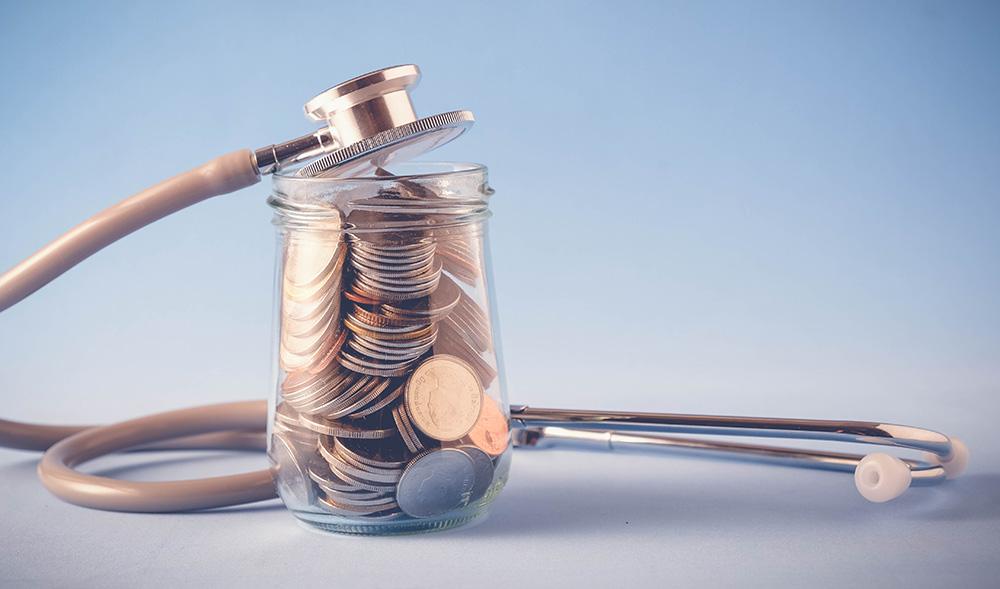 Jar of change with stethoscope wrapped around